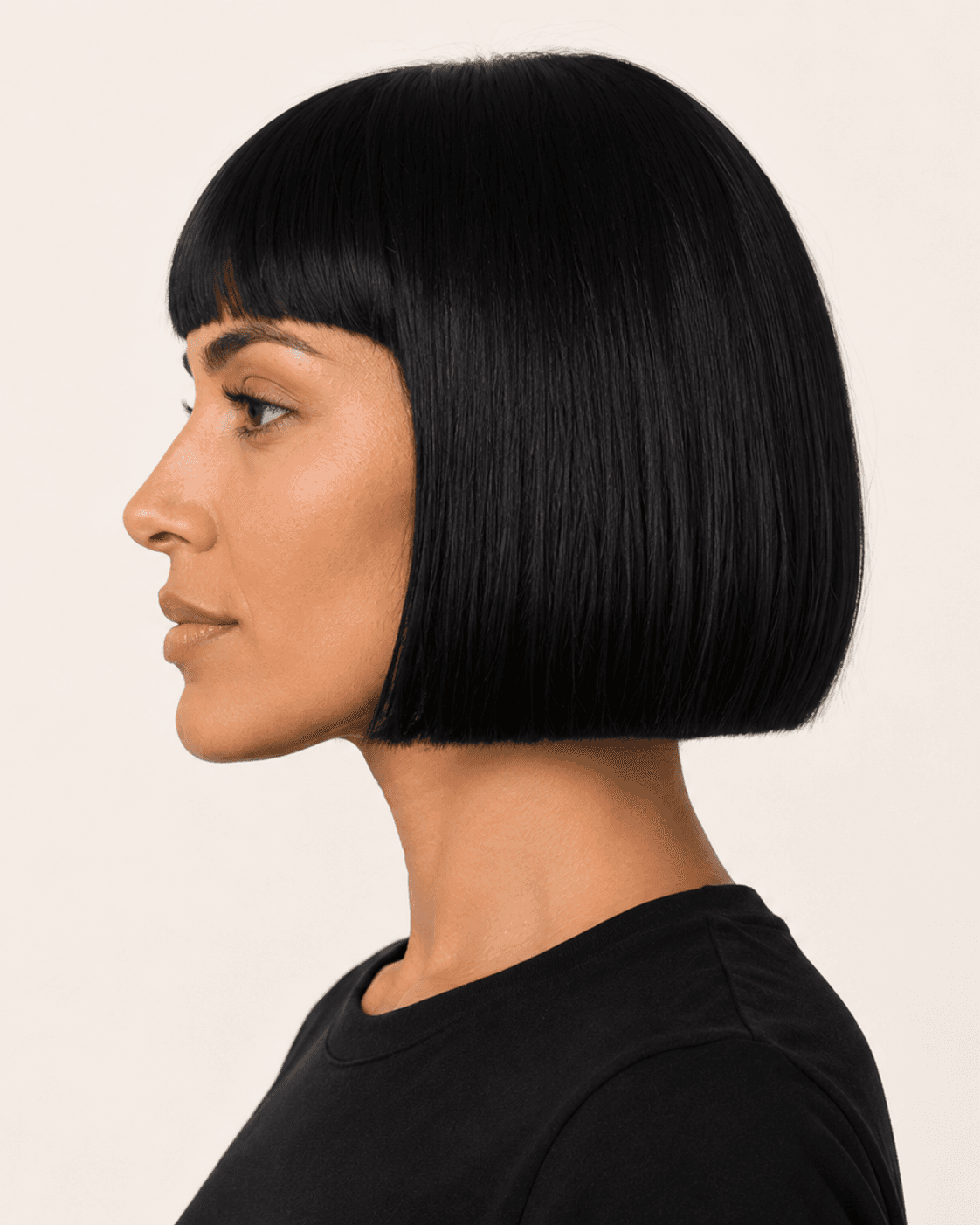 Side profile of a compact blunt-looking bob with short fringe