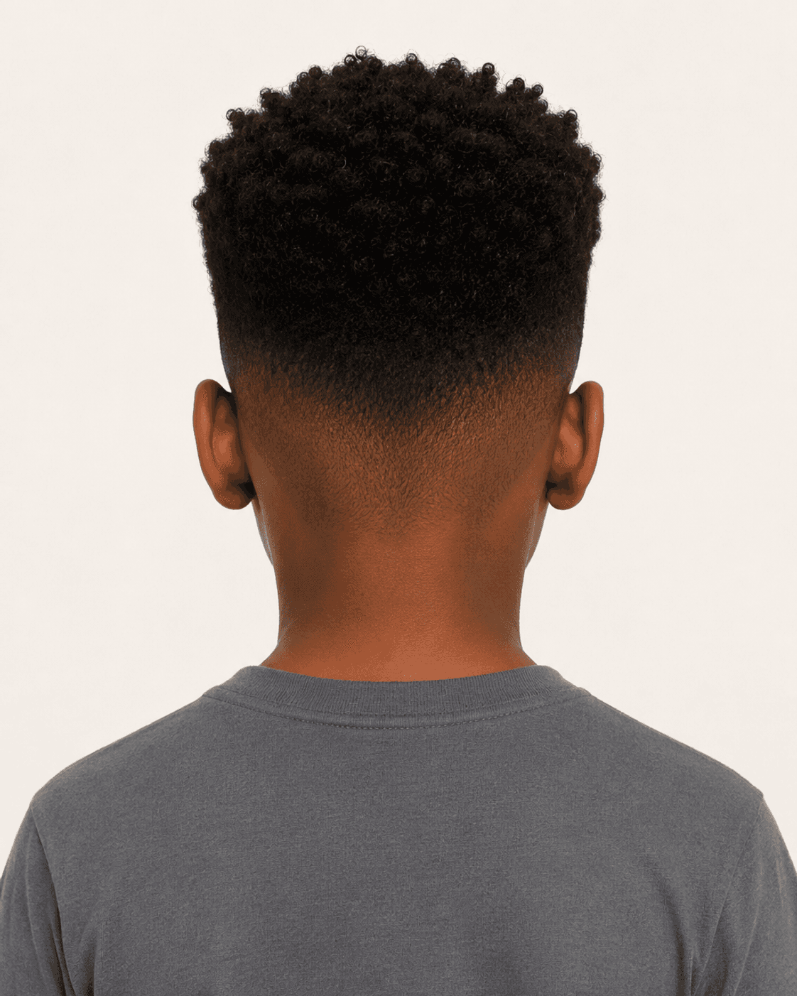 Rear view of a curly high top showing the fade and crown curl pattern