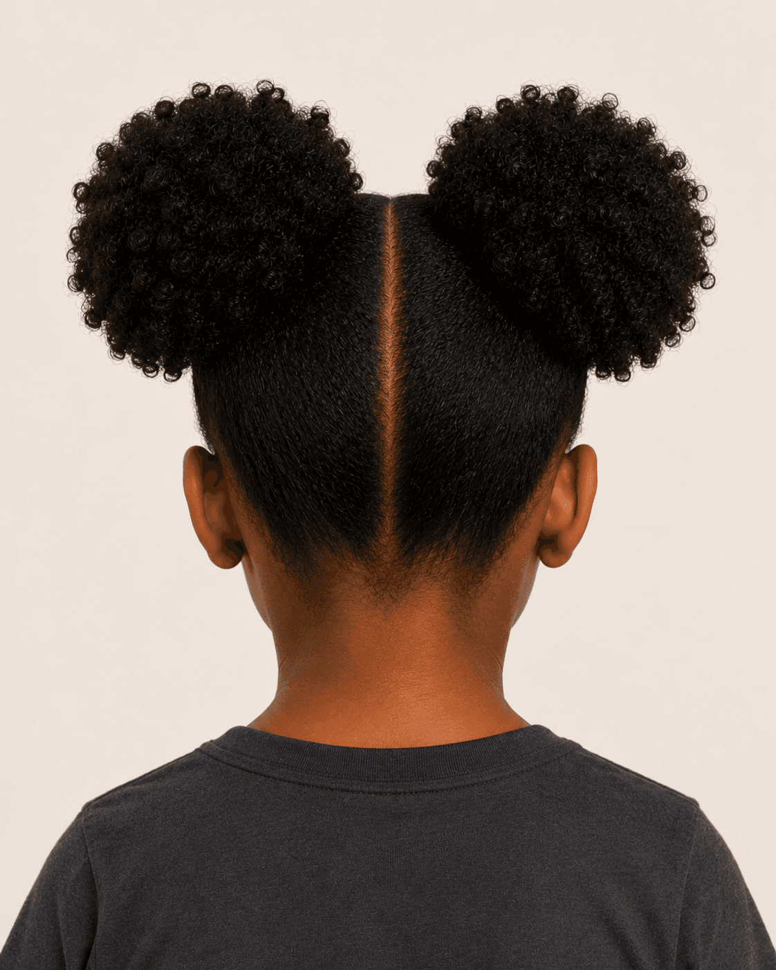 Rear view of a child-safe double-puff reference showing the front-to-nape part and low nape convergence
