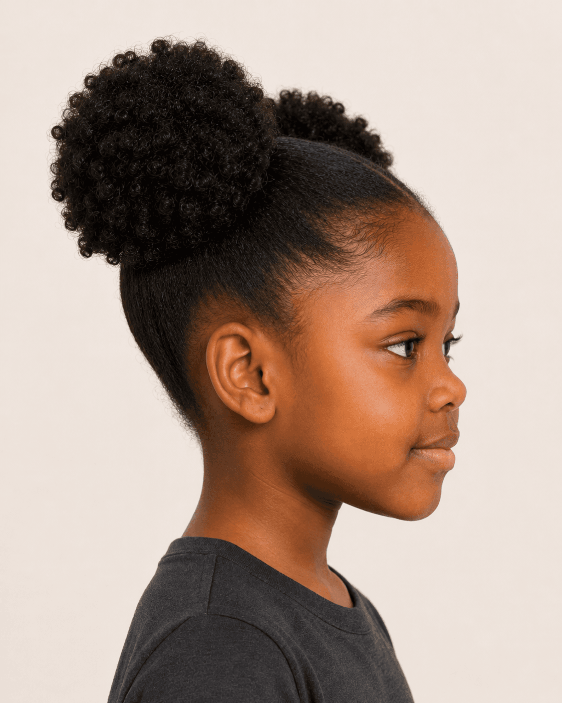 Side profile of a child-safe double-puff reference showing a high lateral puff and swept-up side field