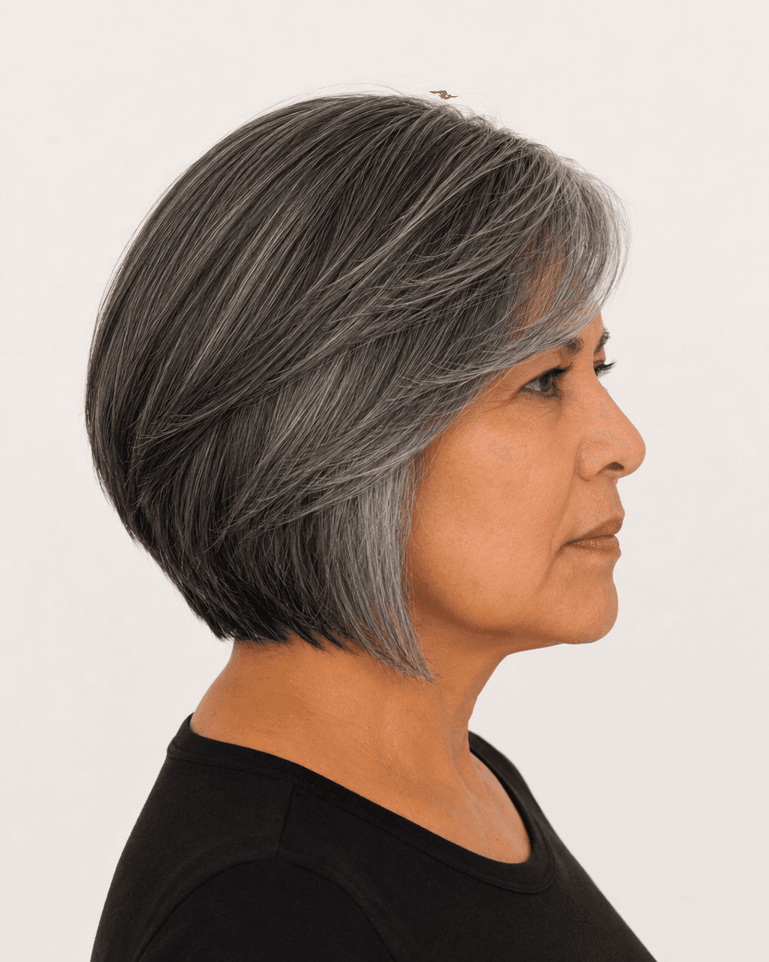 Side profile of a modern bob showing a longer front point and rounded rear field