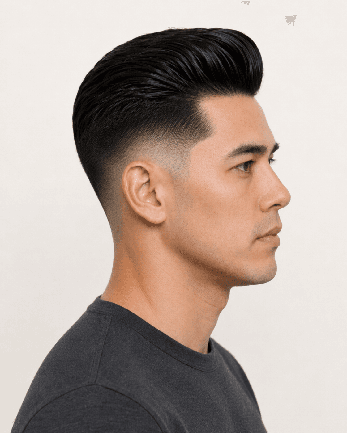 Side profile of a modern pompadour with mid fade showing the fade transition and ear contour