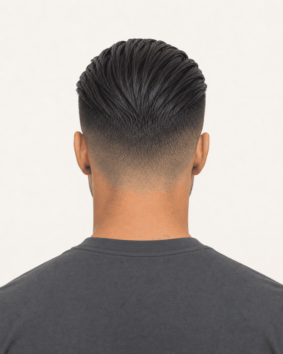 Rear view of a slicked-back undercut showing a symmetric high fade and neckline