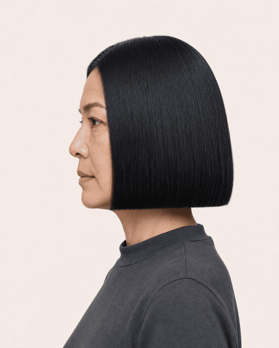 Annotated side construction map for Blunt Chin-Length Bob. Side profile of a blunt chin-length bob showing level baseline and minimal bevel