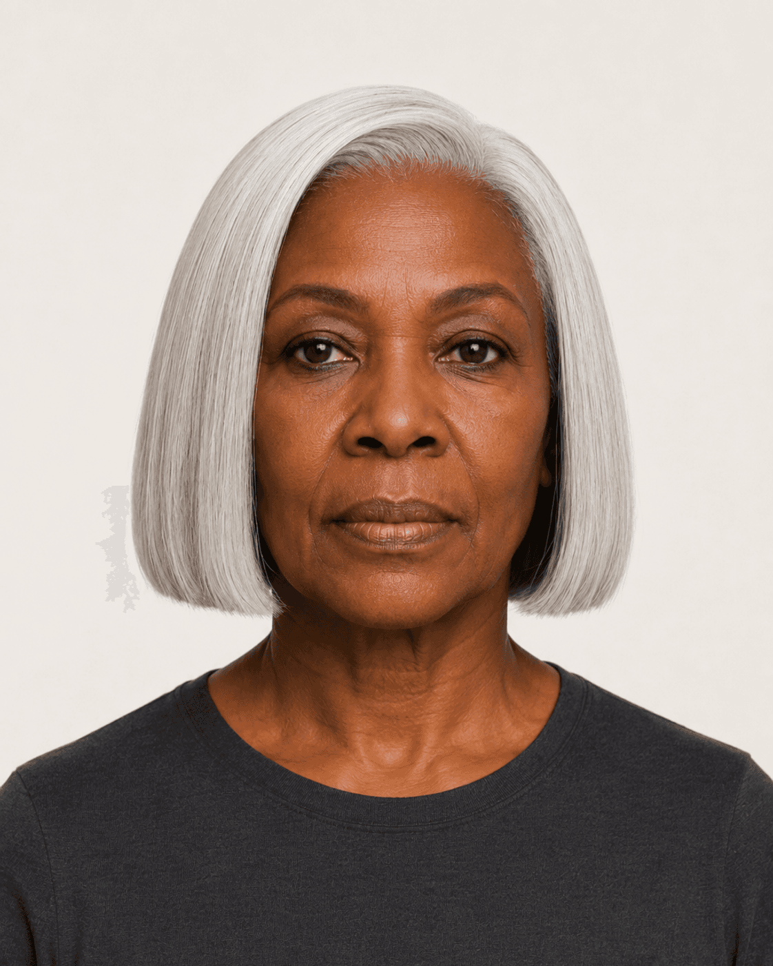 Front view of a classic silver bob with a deep side part and blunt jawline perimeter
