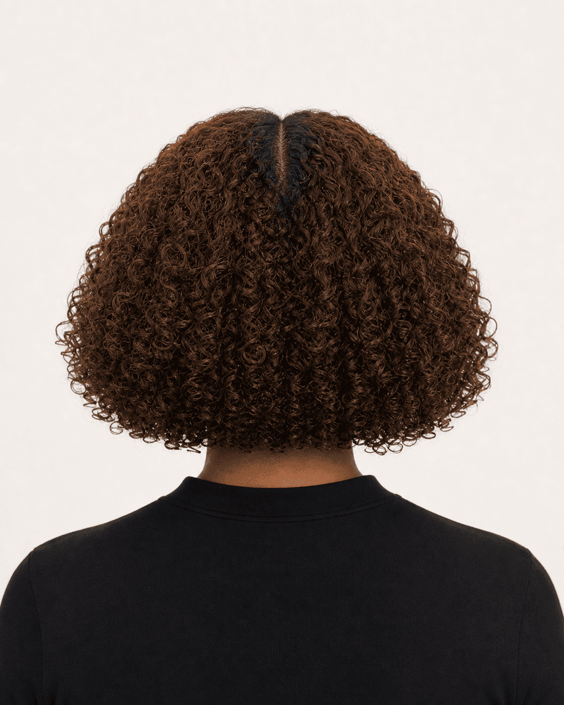 Annotated rear construction map for Rounded Curly Bob. Rear view of a rounded curly bob showing center part, volume, and a balanced perimeter