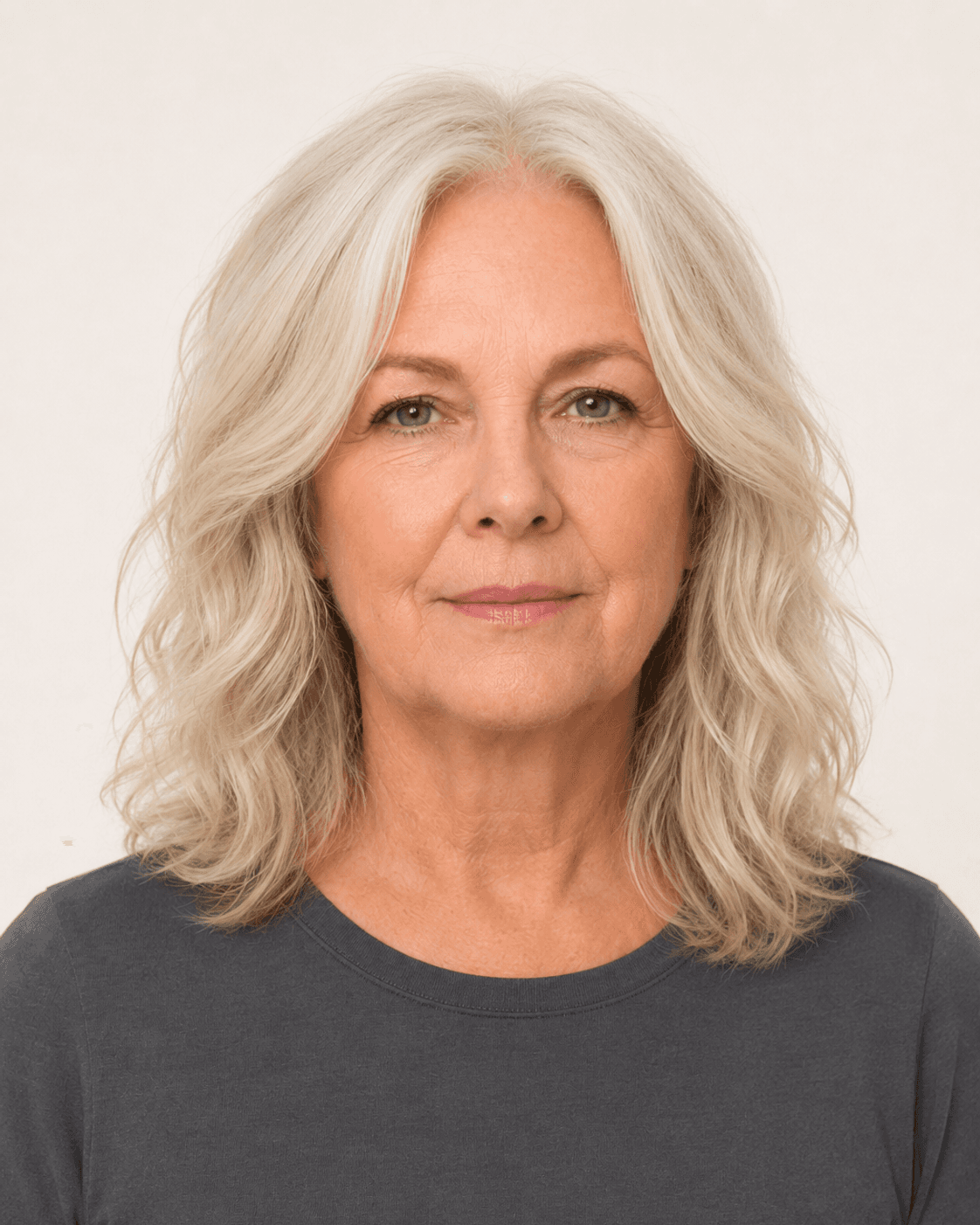 Front view of soft wavy shoulder-length layers with a center part