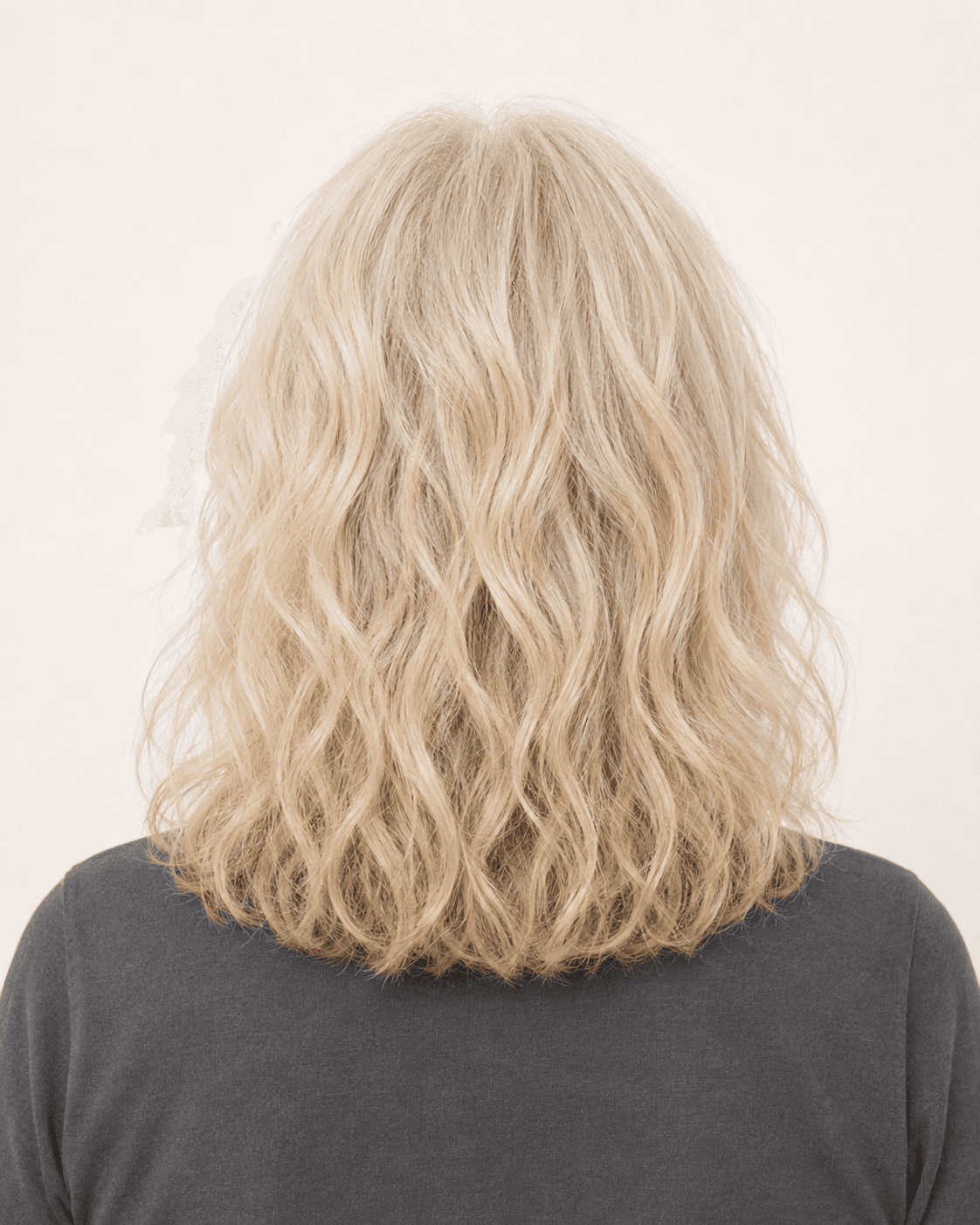 Rear view of soft wavy layers showing the center part and layered perimeter
